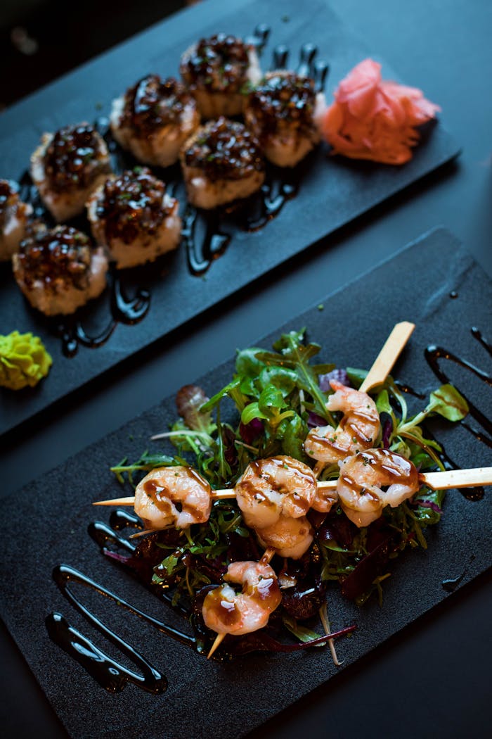Delicious grilled shrimp skewers served with mixed greens and balsamic glaze, perfect for a gourmet dining experience.